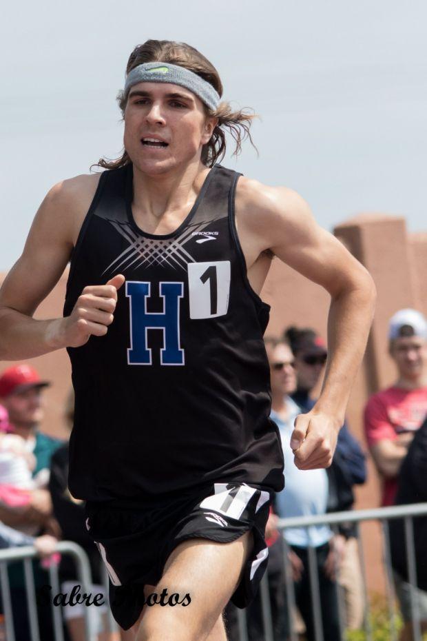 Klecker running the 1600 at Minnesota's state meet, setting a meet record with a 4:06.54 (photo by Greg Kremer)